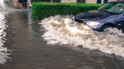 Car driving through flood waters in Margate, NJ