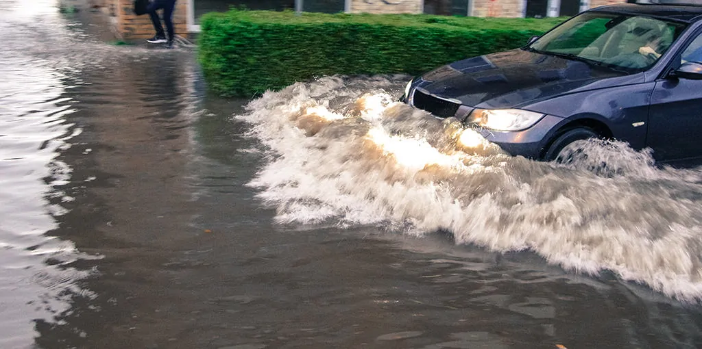Vehicle driving through flood waters in Margate, NJ