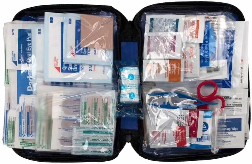 A product image for a first aid kit that shows the product opened, displaying all of the various medical supplies contained inside. 