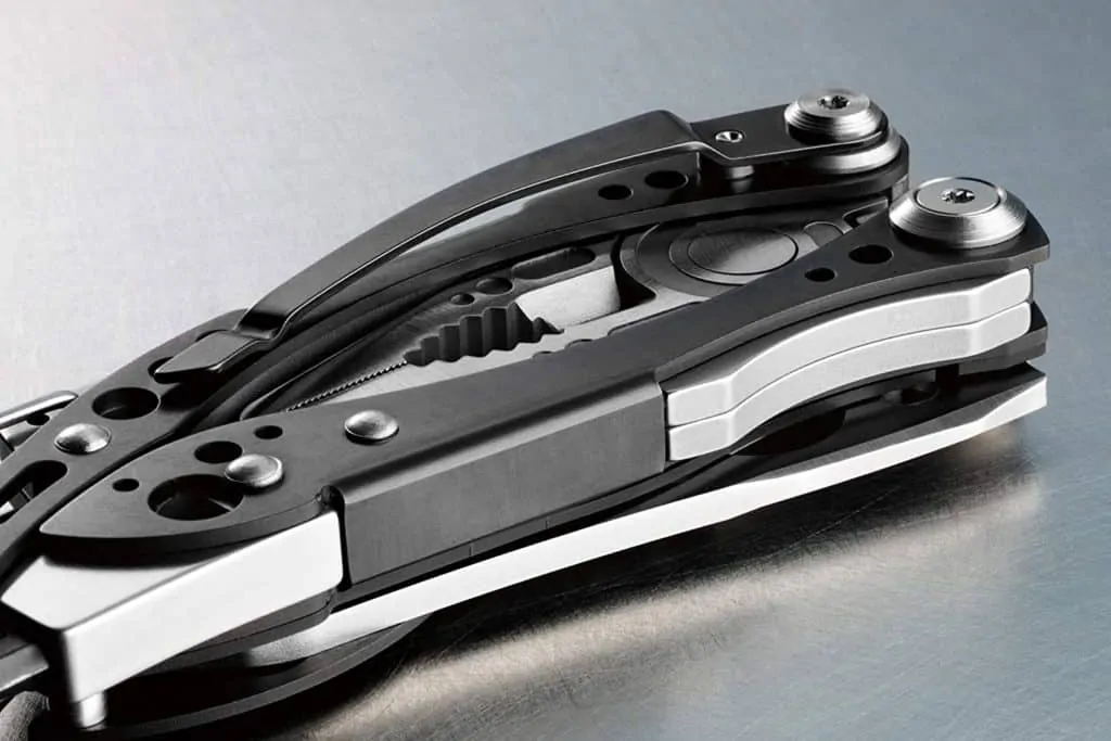 A product image for a multi-tool; the multi tool is black and silver, and appears to be closed with all of the various tools tucked away. 