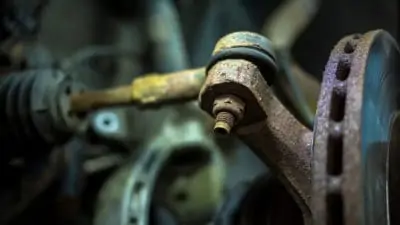 Worn out rusty sway bar needing replacement in our Mays Landing auto repair shop